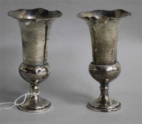 A pair of Edwardian silver spill vases by William Comyns, London, 1907,	 12.8cm.